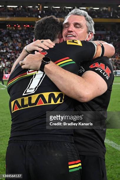 Nathan Cleary of the Panthers hugs his father and coach Ivan Cleary after winning the 2021 NRL Grand Final match between the Penrith Panthers and the...