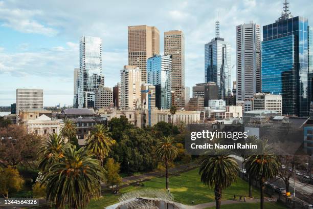 east melbourne city skyline and public gardens on a cloudy day - melbourne ストックフォトと画像