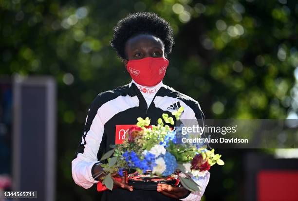 Joyciline Jepkosgei of Kenya celebrates winning the Women's Elite Race during the 2021 Virgin Money London Marathon at Tower Bridge on October 03,...