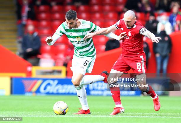 Nir Bitton of Celtic battles for possession with Scott Brown of Aberdeen during the Ladbrokes Scottish Premiership match between Aberdeen and Celtic...