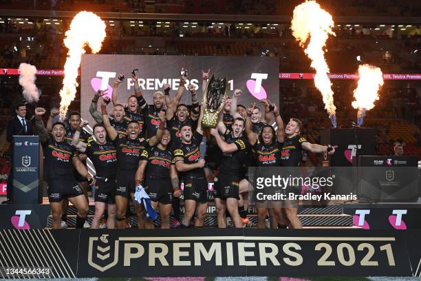 The Panthers celebrate with the Premiership Trophy after winning the 2021 NRL Grand Final match between the Penrith Panthers and the South Sydney...