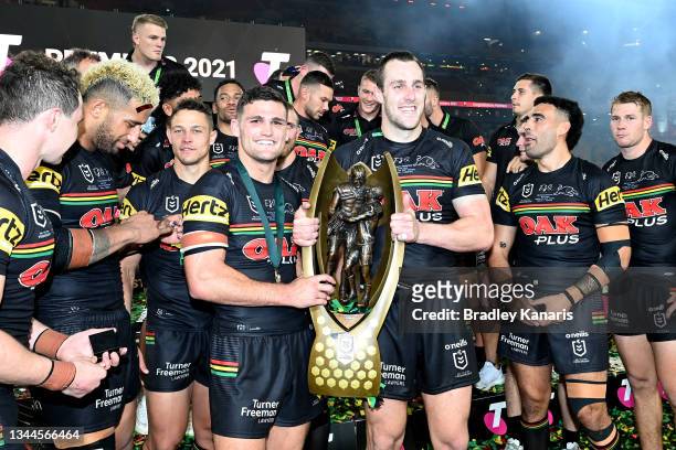 Nathan Cleary of the Panthers and Isaah Yeo of the Panthers hold aloft the Premiership Trophy after winning the 2021 NRL Grand Final match between...