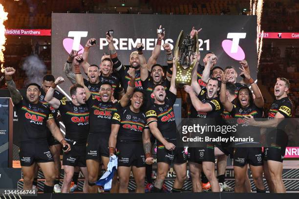 The Panthers celebrate with the Premiership Trophy after winning the 2021 NRL Grand Final match between the Penrith Panthers and the South Sydney...