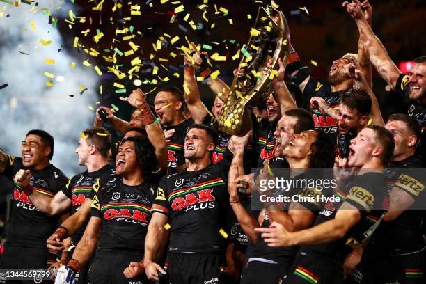 The Panthers celebrate with the NRL Premiership Trophy after victory in the 2021 NRL Grand Final match between the Penrith Panthers and the South...