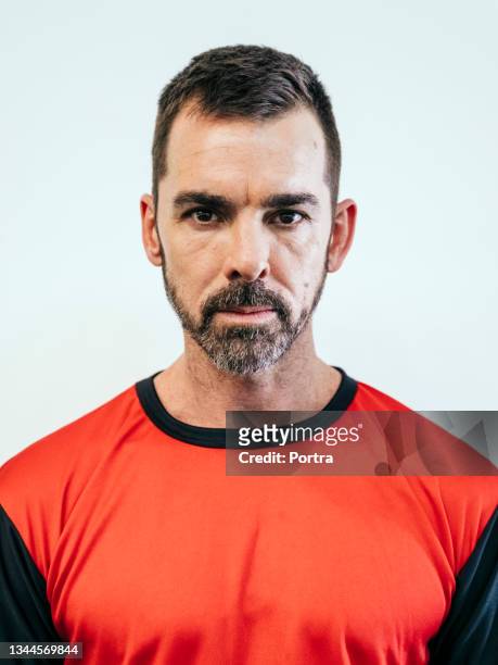 soccer player in red sports jersey - red sports jersey stock pictures, royalty-free photos & images