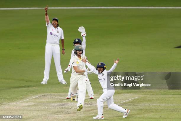 Indian players appeal for the wicket of Ellyse Perry of Australia during day four of the Women's International Test Match between Australia and India...