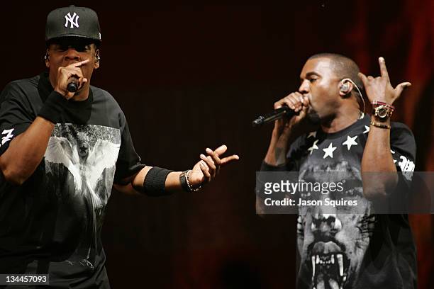 Musicians Jay-Z and Kanye West perform during the "Watch The Throne" tour at Sprint Center on November 29, 2011 in Kansas City, Missouri.