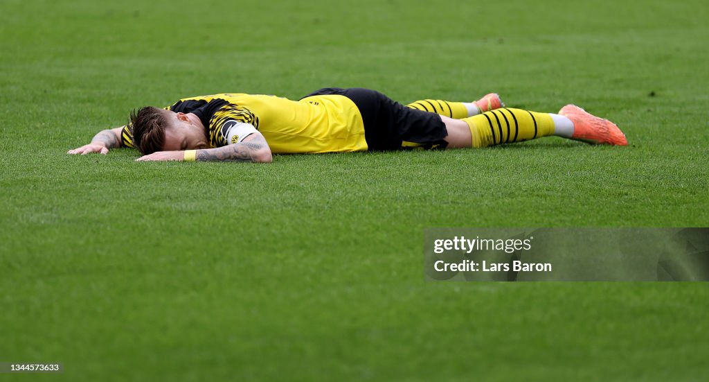 Marco Reus of Dortmund lies on the pitch during the Bundesliga match...  News Photo - Getty Images