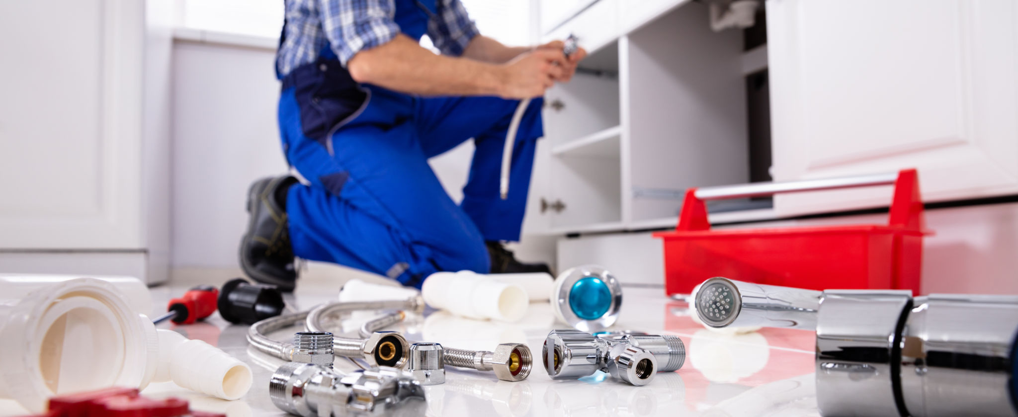 plumber fixing sink