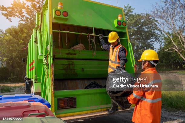 garbage collector,ecology of city life. - garbage collector stock pictures, royalty-free photos & images