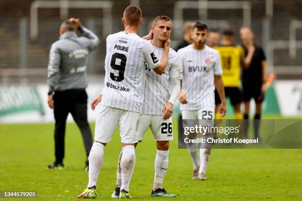 Marvin Pourie and Alexander Lungwitz of Wuerzburg look dejected after losing 0-2 the 3. Liga match between Borussia Dortmund II and Würzburger...