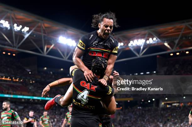 Jarome Luai of the Panthers celebrates with Matt Burton of the Panthers after he scored a try during the 2021 NRL Grand Final match between the...