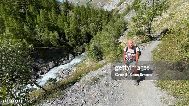 mature woman walking ecrins france - la grave stock-fotos und bilder