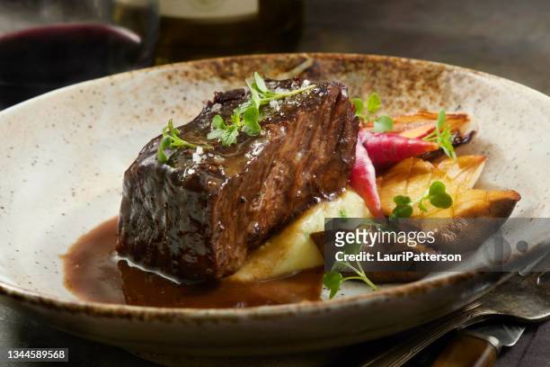 red wine braised boneless short rib with black truffle au jus - braised stock pictures, royalty-free photos & images