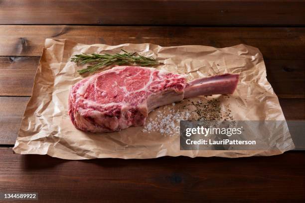 the king of steaks "the tomahawk" - rib eye steak stock pictures, royalty-free photos & images