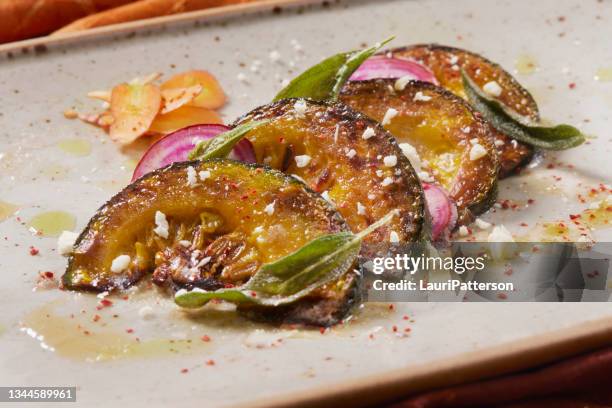 roasted kabocha squash with chioggia beets - acorn squash stock pictures, royalty-free photos & images