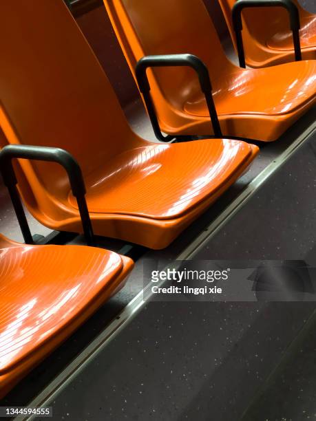 red seats on the bus - vehicle seat stock pictures, royalty-free photos & images