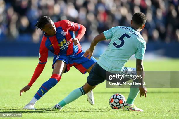 Michael Olise of Crystal Palace is challenged by Ryan Bertrand of Leicester City during the Premier League match between Crystal Palace and Leicester...