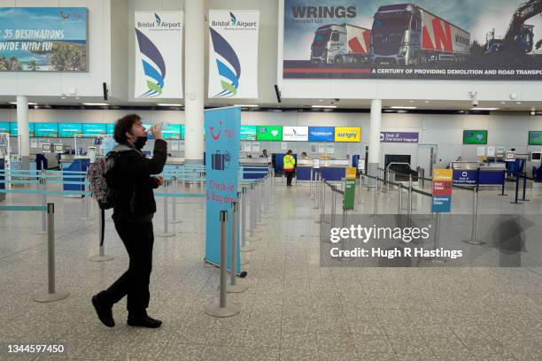 Passengers in the departures hall at Bristol Airport on October 03, 2021 in Bristol, England. Starting tomorrow, the United Kingdom will simplify its...