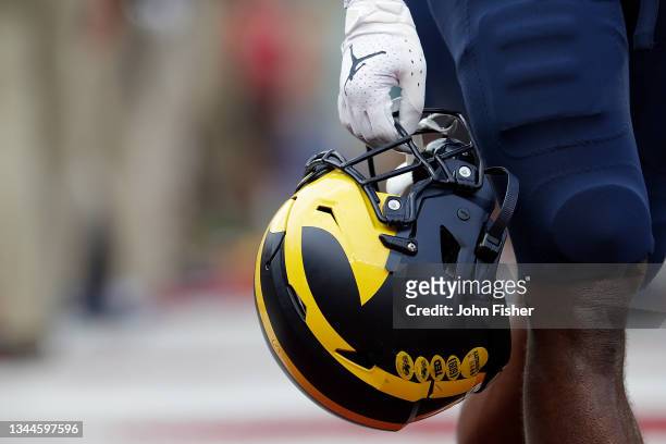 Detailed picture of the "Air-Jordan" football gloves and helmet worn by Michigan players against the Wisconsin Badgers at Camp Randall Stadium on...