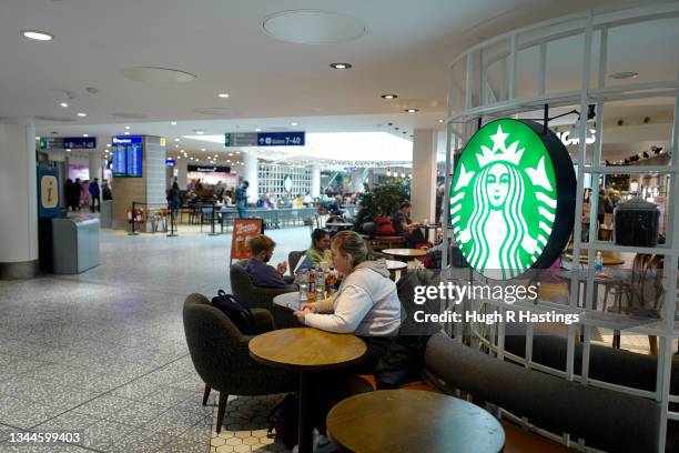 Passengers in the departures lounge at Bristol Airport on October 03, 2021 in Bristol, England. Starting tomorrow, the United Kingdom will simplify...