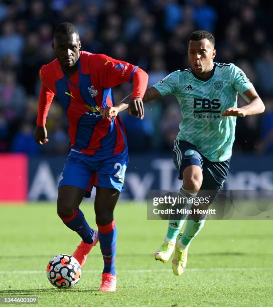 Christian Benteke of Crystal Palace is closed down by Ryan Bertrand of Leicester City during the Premier League match between Crystal Palace and...