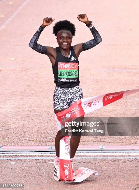 Joyciline Jepkosgei celebrates after winning the women’s elite London Marathon 2021 in The Mall on October 03, 2021 in London, England.