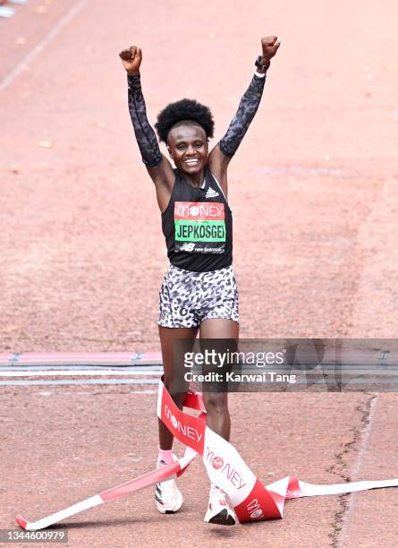 Joyciline Jepkosgei celebrates after winning the women’s elite London Marathon 2021 in The Mall on October 03, 2021 in London, England.