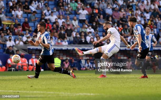 Karim Benzema of Real Madrid scores their side's first goal during the La Liga Santander match between RCD Espanyol and Real Madrid CF at RCDE...