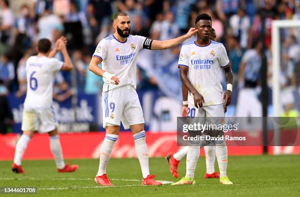 Karim Benzema of Real Madrid celebrates with teammate Vinicius Junior after scoring their side's first goal during the La Liga Santander match...