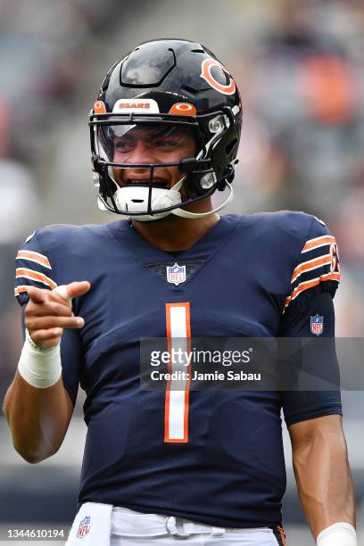 Justin Fields of the Chicago Bears warms up before the game against the Detroit Lions at Soldier Field on October 03, 2021 in Chicago, Illinois.