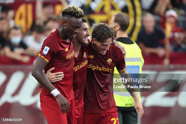 Lorenzo Pellegrini of AS Roma celebrates with teammates Tammy Abraham and Nicolo Zaniolo after scoring their side's first goal during the Serie A...