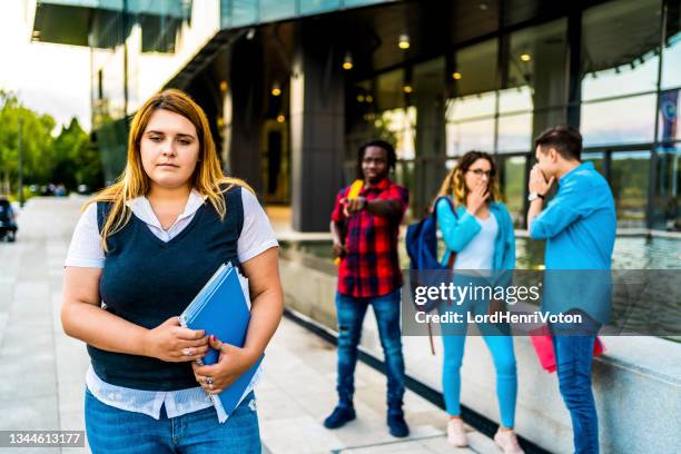 college friends bully their overweight classmate - bullying adults stock pictures, royalty-free photos & images