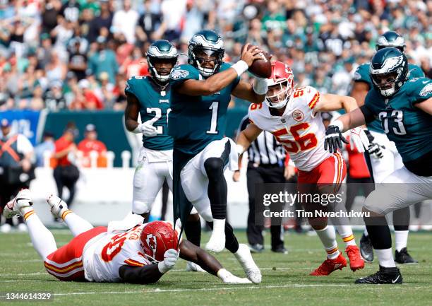 Jalen Hurts of the Philadelphia Eagles avoids a tackle by Jarran Reed of the Kansas City Chiefs during the first quarter at Lincoln Financial Field...