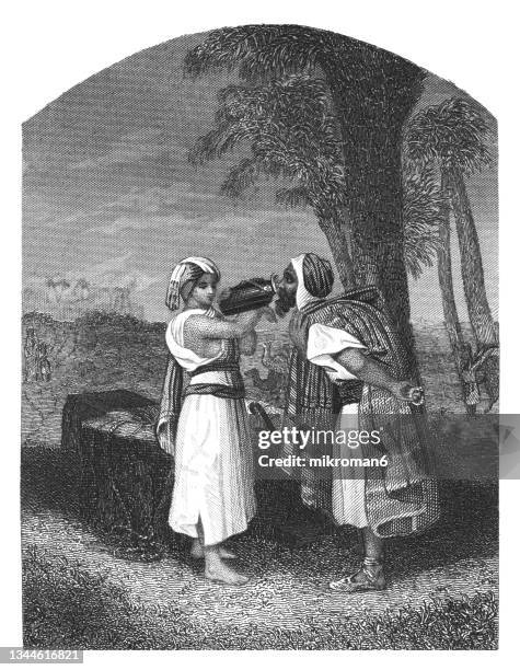 old engraved illustration of rebekah at the well - rebeca personaje bíblico fotografías e imágenes de stock