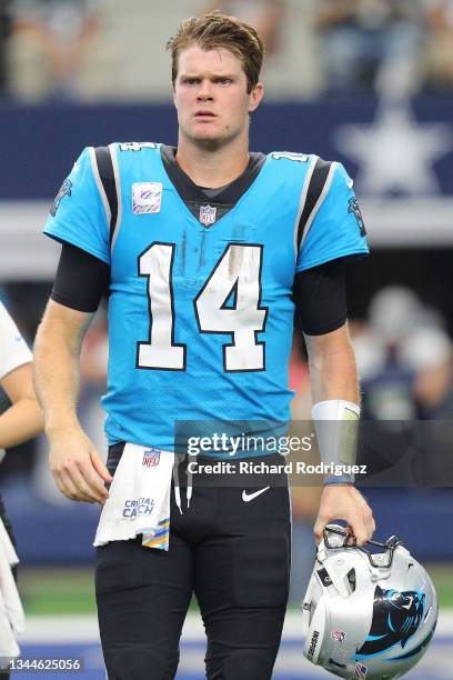 Sam Darnold of the Carolina Panthers looks on during the first half against the Dallas Cowboys at AT&T Stadium on October 03, 2021 in Arlington,...