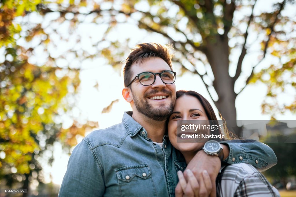 Young Couple and Autumn sunny day
