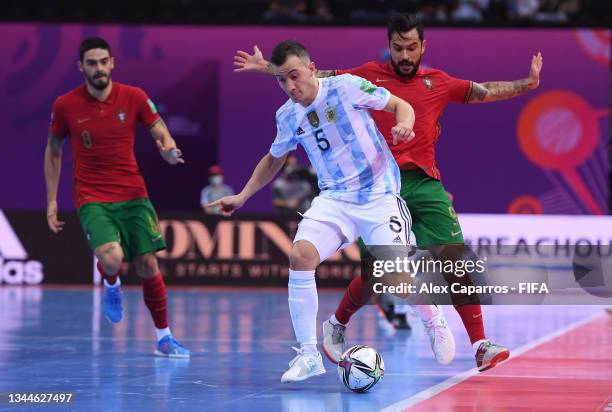 Maximiliano Rescia of Argentina battles for possession with Joao Matos of Portugal during the FIFA Futsal World Cup 2021 Final match between...