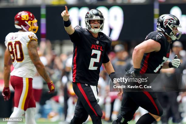 Quarterback Matt Ryan of the Atlanta Falcons reacts after a touchdown pass against the Washington Football Team in the second half at Mercedes-Benz...