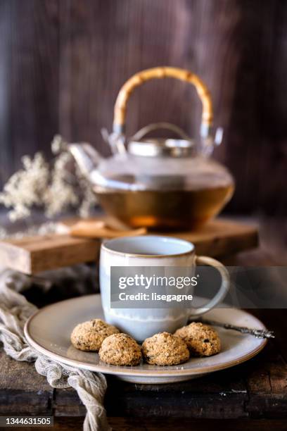 tea and cookies - almond cookies stock pictures, royalty-free photos & images