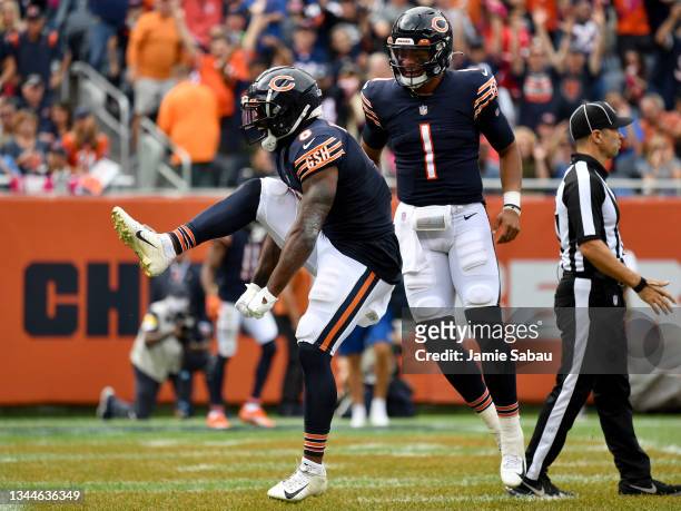 Damien Williams and Justin Fields of the Chicago Bears react in the end zone after Williams scored a touchdown during the second half against the...