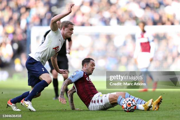 Danny Ings of Aston Villa in action with Oliver Skipp of Tottenham Hotspur during the Premier League match between Tottenham Hotspur and Aston Villa...