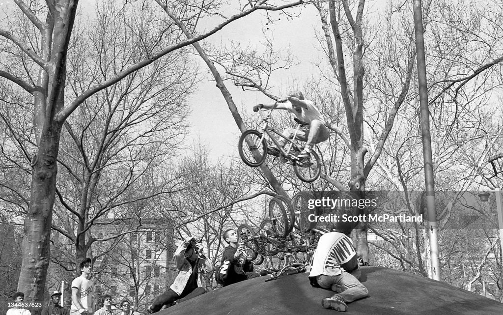 Bike Rider Performs A Stunt In Washington Square Park