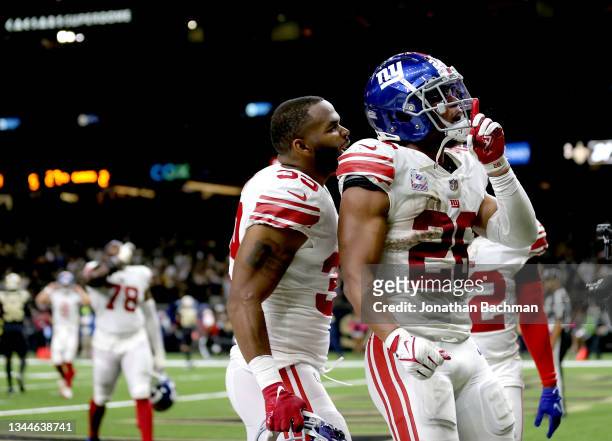 Saquon Barkley of the New York Giants reacts after scoring the game winning touchdown in the game against the New Orleans Saints in overtime at...