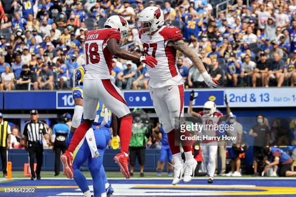 Maxx Williams and A.J. Green of the Arizona Cardinals celebrate Williams' second quarter touchdown catch against the Los Angeles Rams at SoFi Stadium...