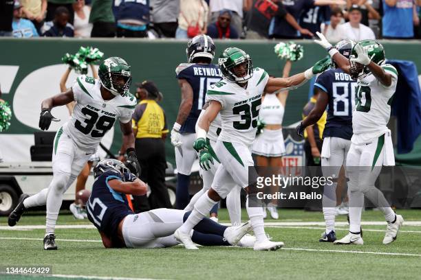 Sharrod Neasman of the New York Jets celebrates after stopping Nick Westbrook-Ikhine of the Tennessee Titans during overtime at MetLife Stadium on...