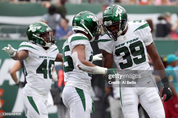 Sharrod Neasman of the New York Jets celebrates after stopping Nick Westbrook-Ikhine of the Tennessee Titans during overtime at MetLife Stadium on...