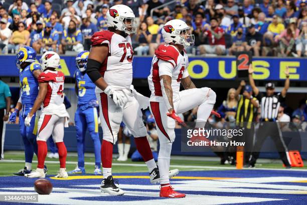 James Conner of the Arizona Cardinals celebrates his touchdown with Max Garcia in the second quarter against the Los Angeles Rams at SoFi Stadium on...