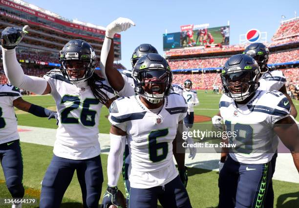 Quandre Diggs of the Seattle Seahawks celebrates an interception with teammates during the first quarter against the San Francisco 49ers at Levi's...