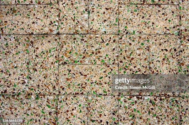 building exterior wall of crushed recycled glass and concrete bricks - recycled material stock pictures, royalty-free photos & images